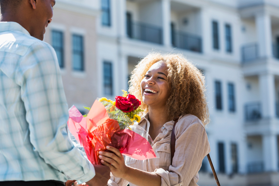 just because flowers with woman getting flowers from man