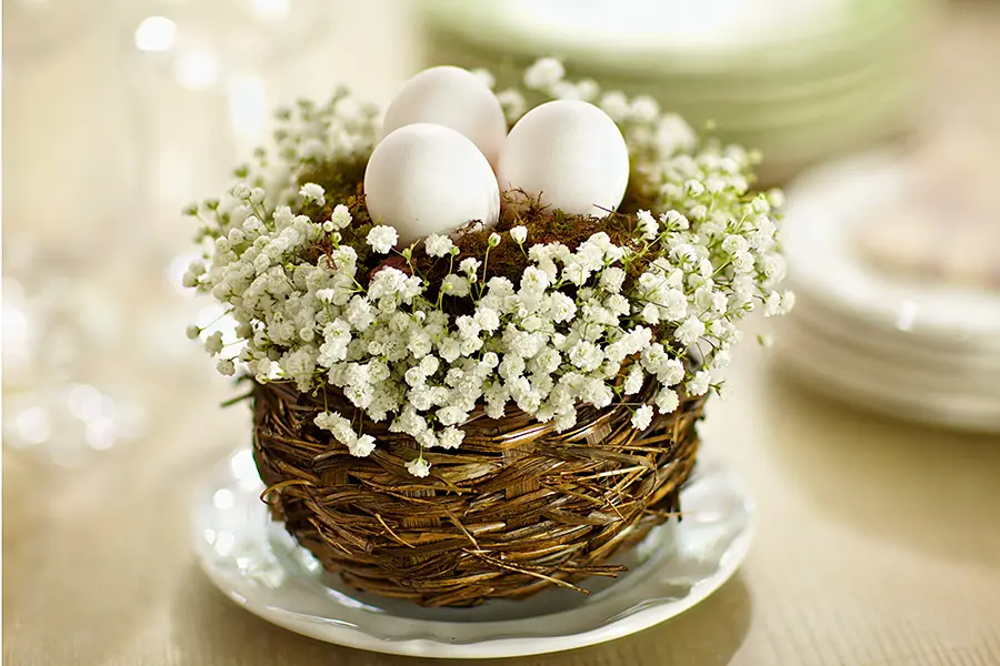 baby shower decor ideas with Small centerpiece with eggs and baby’s breath