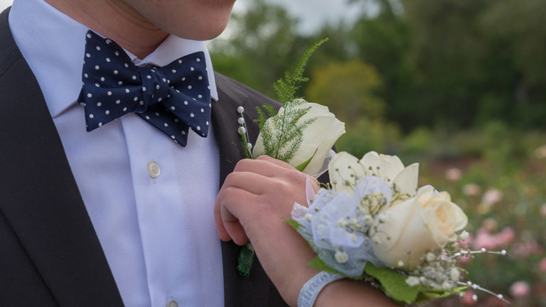 a photo of corsage and boutonniere: hero