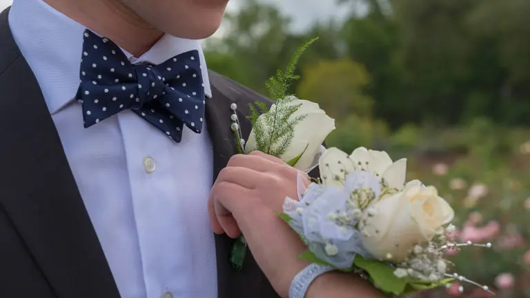 a photo of corsage and boutonniere: hero