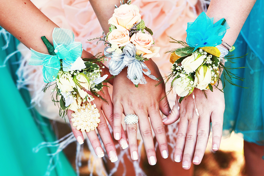 A photo of corsage and boutonniere with wrist corsages