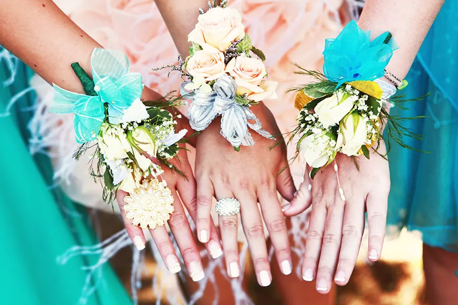 A photo of corsage and boutonniere with wrist corsages