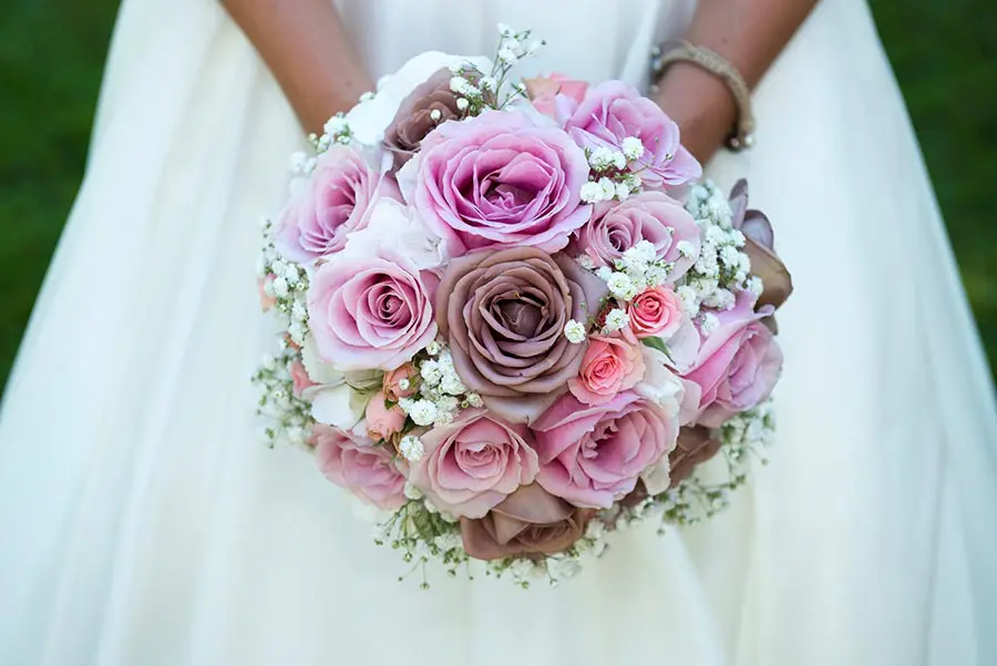 wedding traditions with bride holding her pink wedding bouquet