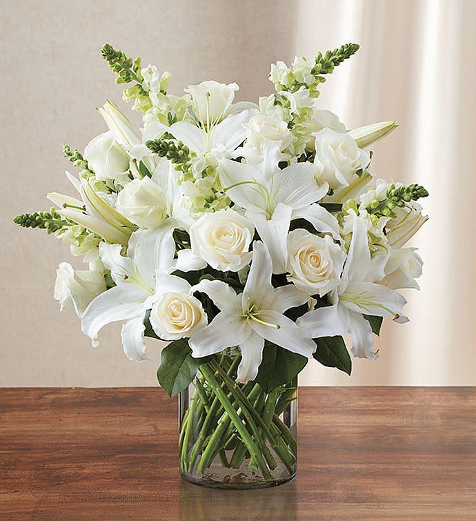 A bouquet of white roses and lilies.