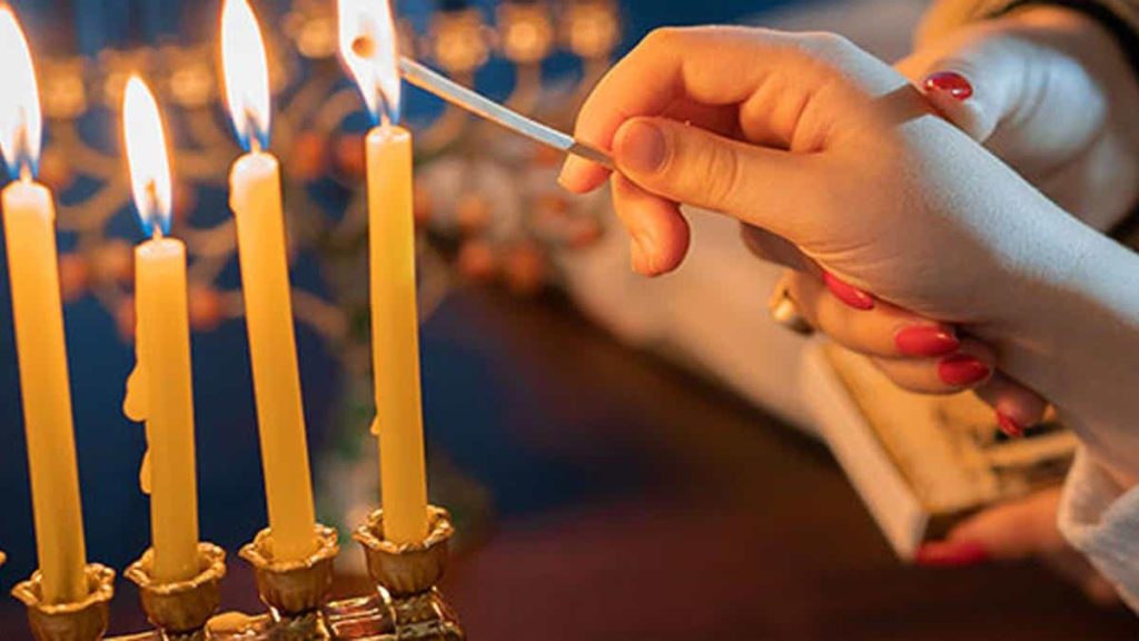 family activities for hanukkah with Lighting Menorah
