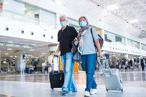 Couple shopping while wearing masks