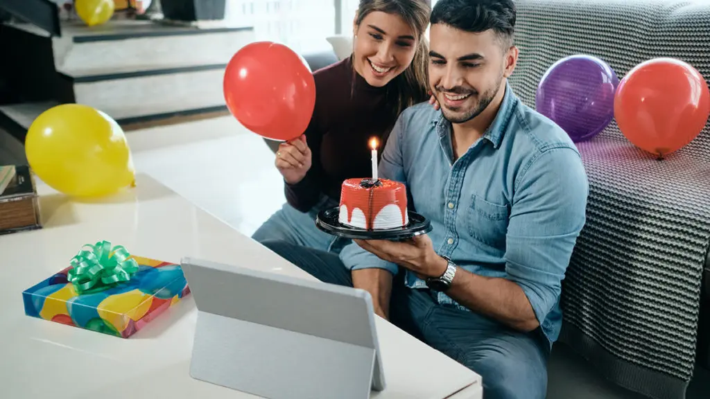 Man and woman celebrating virtual birthday