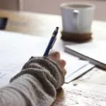Person writing note