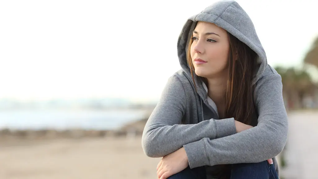 Woman sitting on the beach