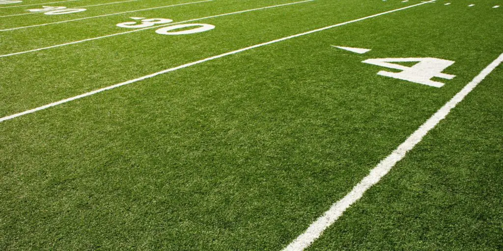 Photo of an American football field, the site of a fun love story.