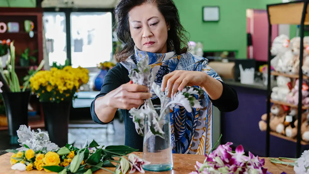 Local florist Vivian Chang arranges flowers at her Los Angeles-area shop
