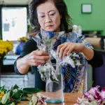 Local florist Vivian Chang arranges flowers at her Los Angeles-area shop
