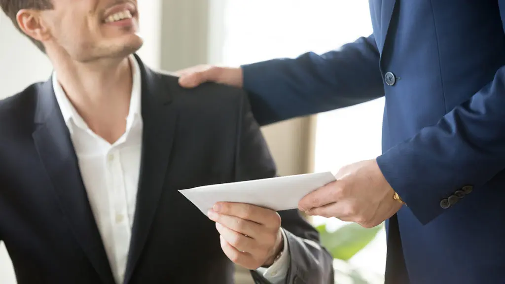 Boss congratulating employee