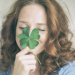 Woman with four-leaf clover