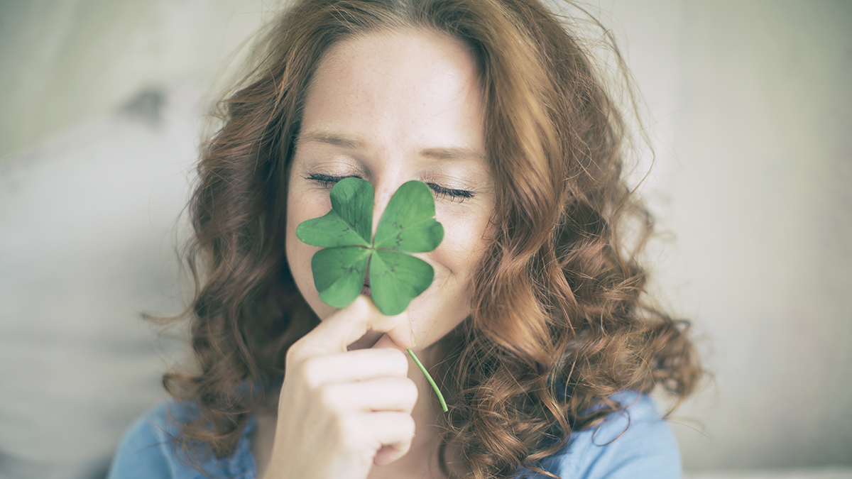 Woman with four-leaf clover