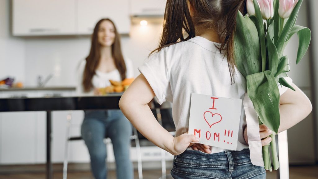 Girl with card for mom