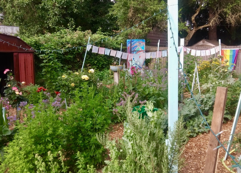 Backyard with flowers and artwork