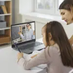 Mom and daughter on laptop