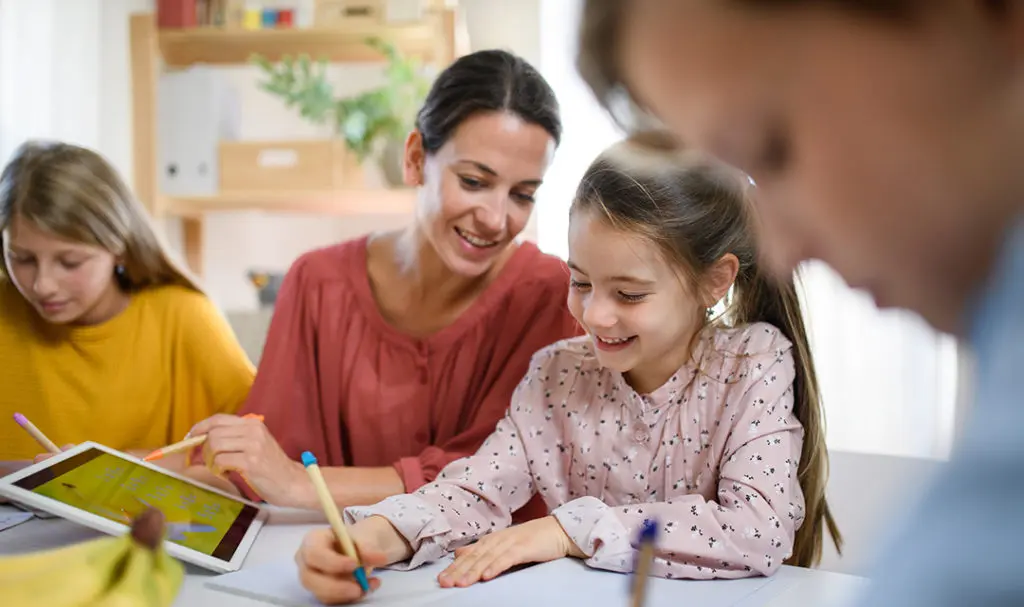 Kids doing homework with parents