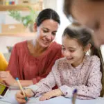 Kids doing homework with parents