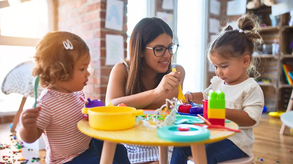 Photo of a young mother tutoring her children