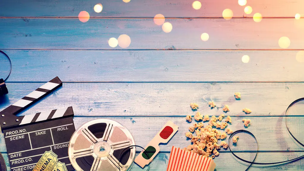 Movie sign, tickets, glasses, and popcorn