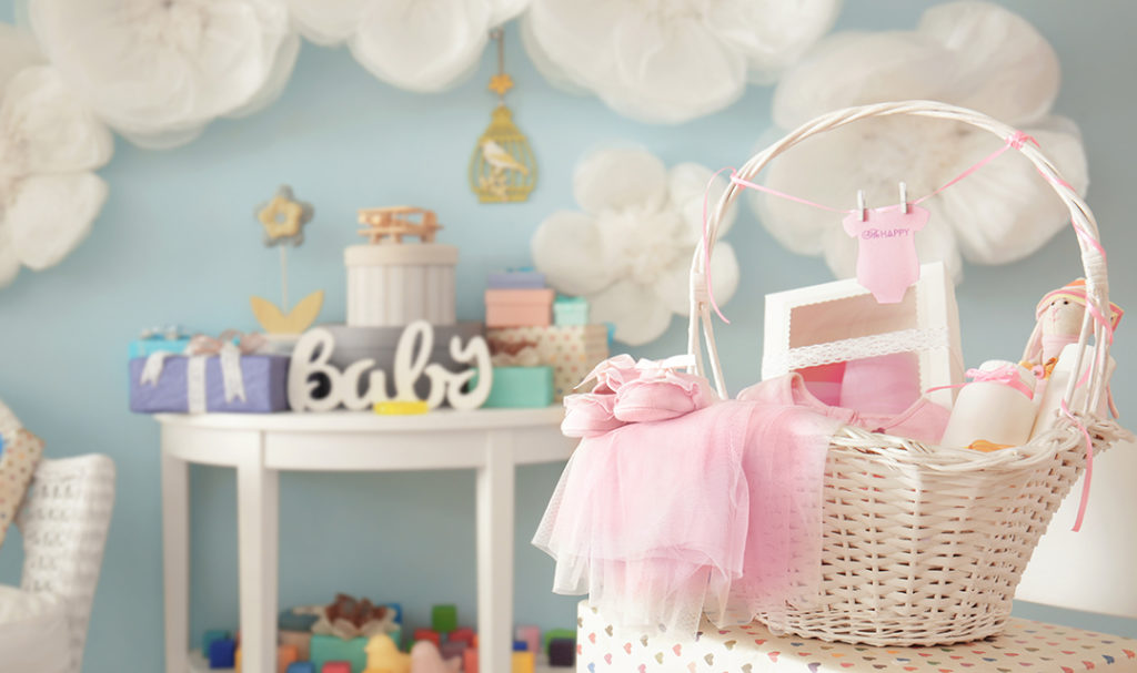 Baby's room with basket of baby gifts