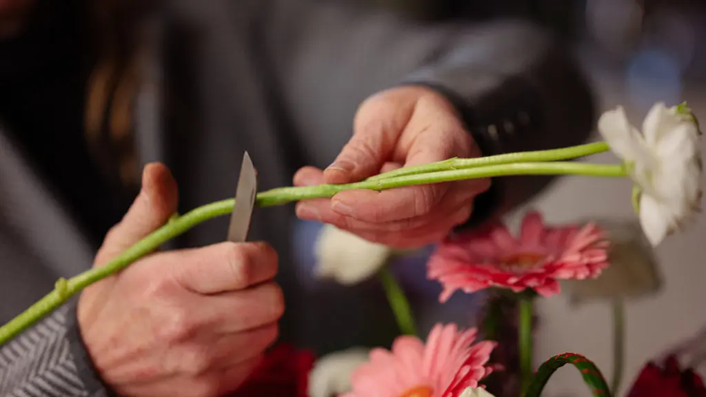 Local florist Patti Fowler trims flower stems
