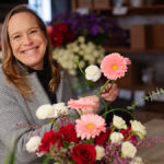 Local florist Patti Fowler arranges a collection of flowers