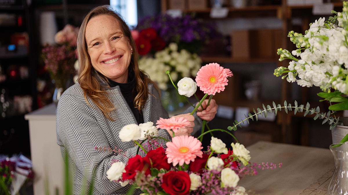 Local florist Patti Fowler arranges a collection of flowers