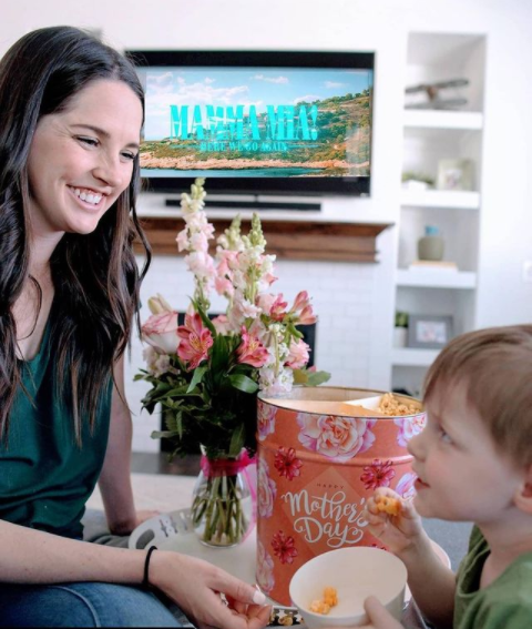 Mom and son waching Mamma Mia movie