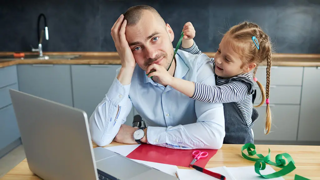 a photo of daddy brain with a dad working from home with his daughter