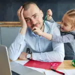 a photo of daddy brain with a dad working from home with his daughter