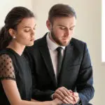 Photo of couple mourning at funeral