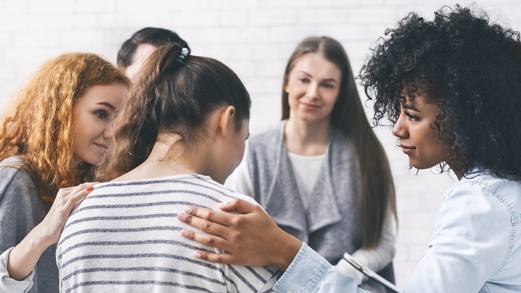 Difficult anniversary with group of women supporting grieving friend