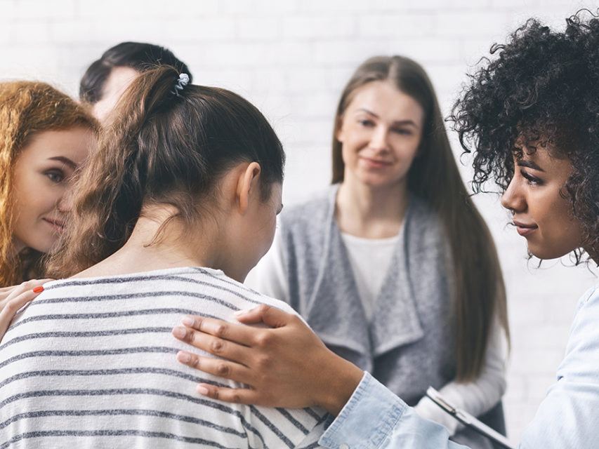 Difficult anniversary with group of women supporting grieving friend