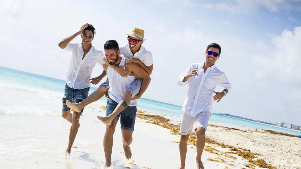 Men running on beach