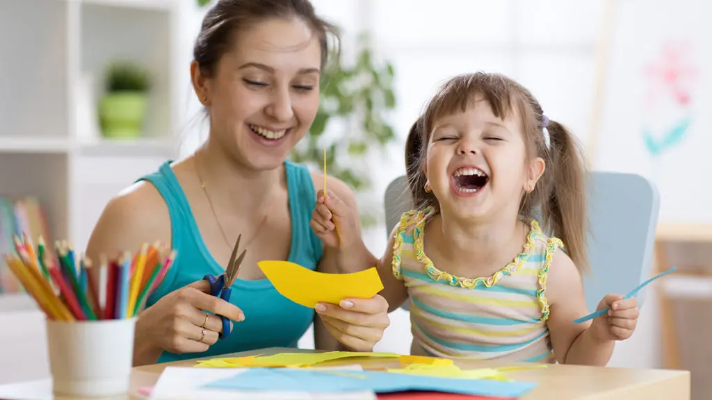 Woman and girl laughing