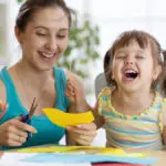 Woman and girl laughing