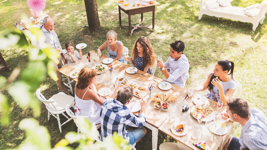 Family eating dinner outside