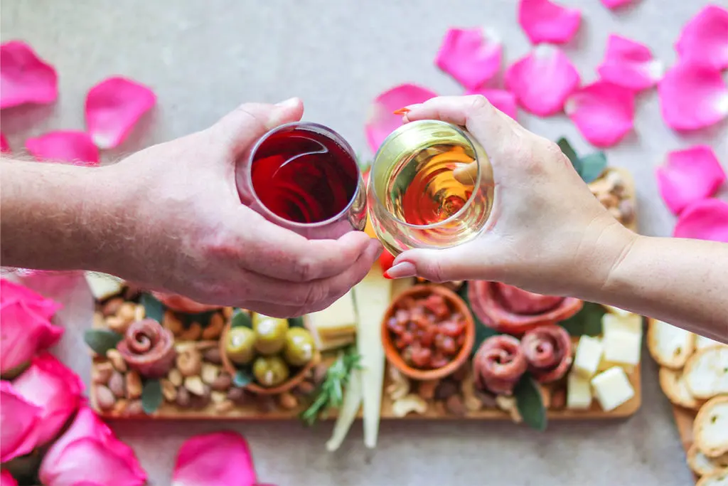 Photo of charcuterie board with wine and charcuterie board