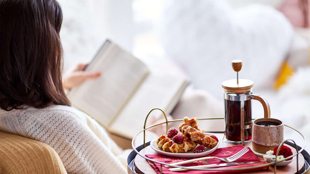 teacher gifts with teacher reading book and drinking coffee