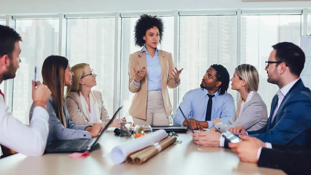 Photo of a meeting at a diverse workplace, illustrating the importance of workplace diversity.