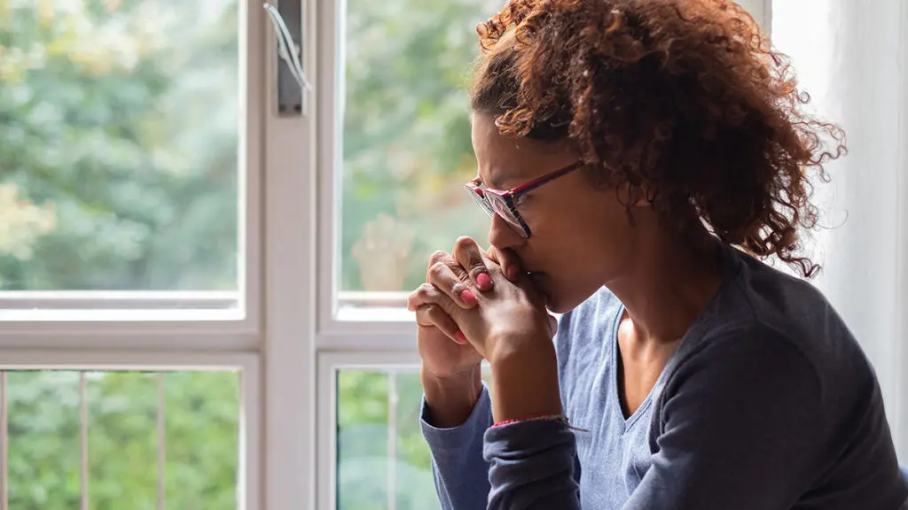 The importance of remembrance: In this image, a woman remembers a lost loved one.