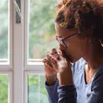 The importance of remembrance: In this image, a woman remembers a lost loved one.