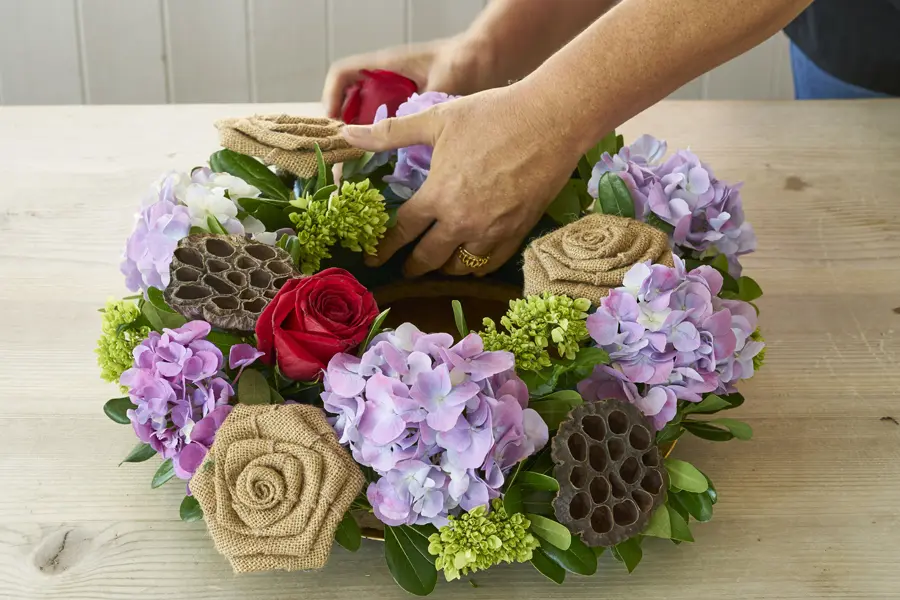 diy fall wreath with adding berries and autumnal leaves