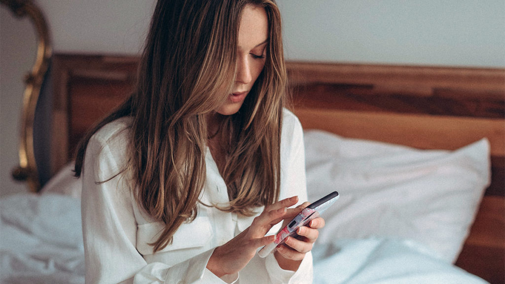 Photo of a woman who reaches out to a friend to combat loneliness