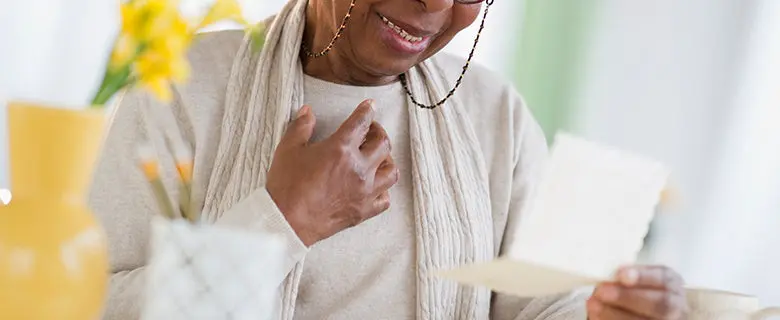 Photo of a woman receiving well wishes after an illness