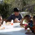 photo of children eating lunch at a table