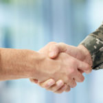 honoring veterans with shaking hands with veteran